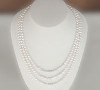 Triple strand of rice shaped pearl necklace