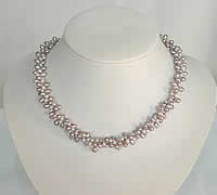 Twisted triple strand of rice shaped pearl necklace
