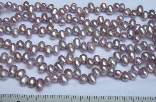 7mm grade AA rice shaped purple pearl strands